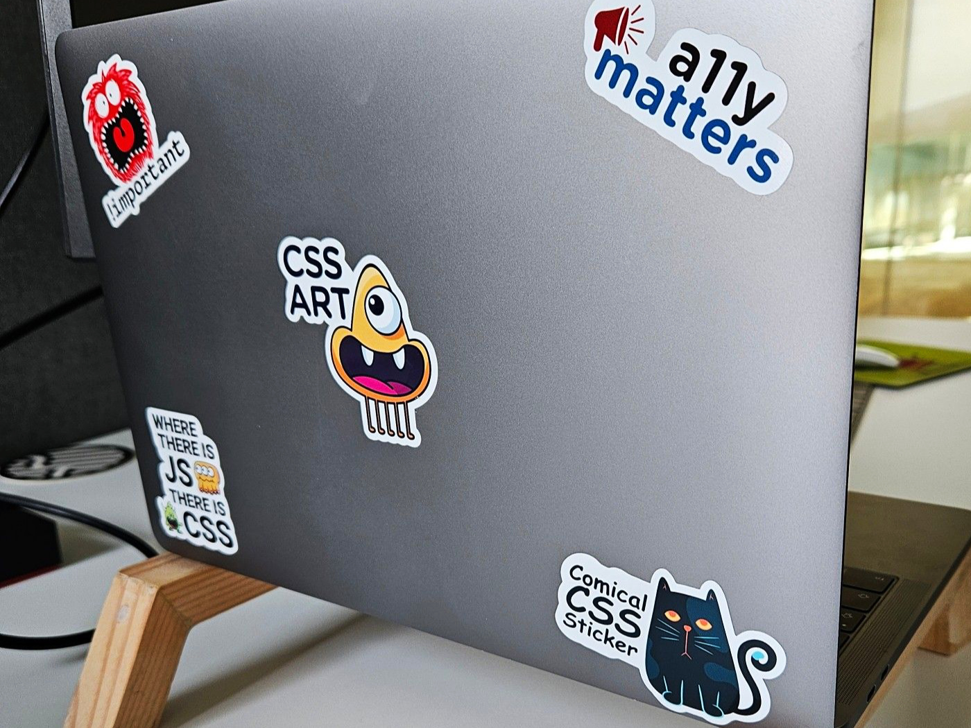Aurélie Touchard's laptop with a number of CSS Stickers.